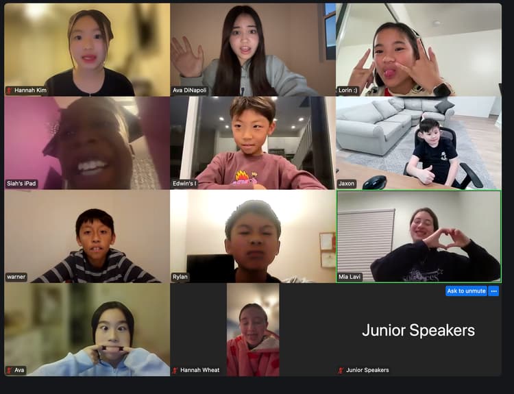 Students smiling on a Junior Speakers online session